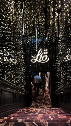 A vibrant dinner show in London featuring delicious food and immersive entertainment.