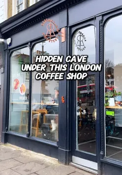 Cozy London coffee shop interior at Redemption Roasters, featuring unique decor under tables. #hiddenlondon #coffee