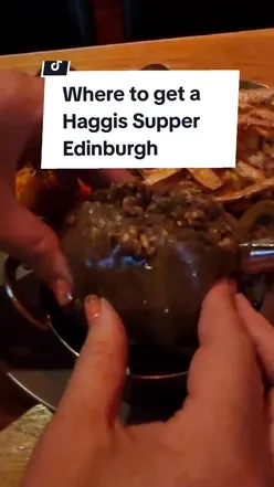 Authentic Scottish haggis platter at Angels Share, Edinburgh, with neeps, mash, whisky gravy, and optional whisky flight.