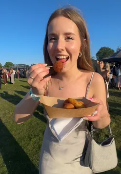 A vibrant spread of food and drinks enjoyed at Winestock, showcasing delicious bites and flowing beverages.