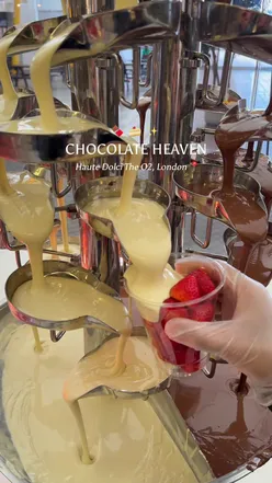 Chocolate lovers indulging in decadent treats at Haute Dolci in London, featuring fondue, strawberries, and desserts.