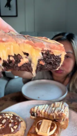 Assorted homemade desserts from Pont Bakehouse, including billionaire brownie, Nutella cookie, and Biscoff rocky road.