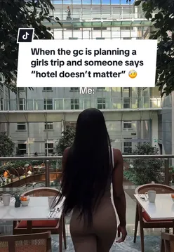 Luxury hotel room with white sheets, modern bathroom, and city views, perfect for travel enthusiasts in London.