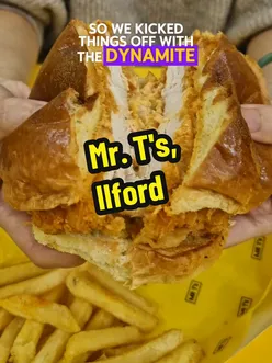 Customers enjoying burgers and shakes at a new hyped burger spot in Ilford, London, with a fun basketball setup.