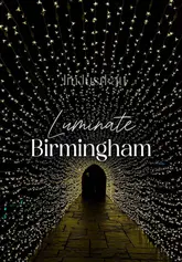 Couple enjoying a magical date at a light show in Birmingham, surrounded by enchanting seasonal lights.