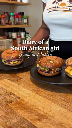 Dublin morning: influencer vlogging at a local cafe, bagel breakfast and coffee, Dublin life vibes on a bustling city street.