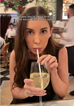 Illuminated Eiffel Tower sparkles at night, capturing a magical moment in Paris.