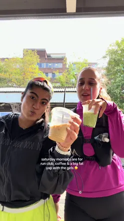 Runners and Stunners enjoying a lively race event outdoors with enthusiastic participants and vibrant branding.