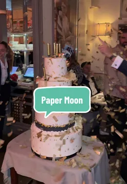 Diners enjoying fine dining at Paper Moon in Raffles OWO, rated 5 stars, a luxurious London experience.