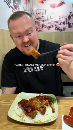 Delicious trio of Hong Kong roast meats at Nice Spice in Bristol, featuring crispy pork, roast pork, and duck.