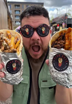 Gyro Guys serving loaded Greek wraps at Herbert's Yard, showcasing unique flavors for street food lovers.