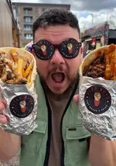 Gyro Guys serving loaded Greek wraps at Herbert's Yard, showcasing unique flavors for street food lovers.