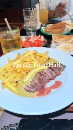 Delicious chicken shawarma, steak combinado, pork tacos, and drinks at Arcade Food Hall, Tottenham Court Road.