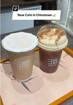 Visitors enjoying authentic Yunnan Chinese tea at a hidden cafe in Chinatown, London.