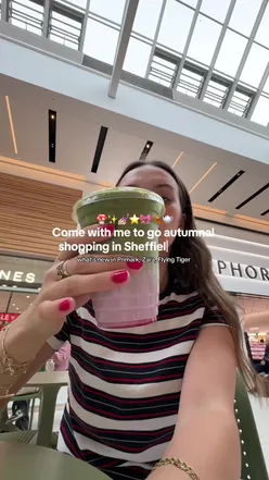 Person shopping in Zara during autumn, showcasing cozy fashion vibes in Sheffield.