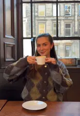 27-year-old enjoying a perfect Sunday in Edinburgh, sipping coffee, shopping, and dining at local restaurants.