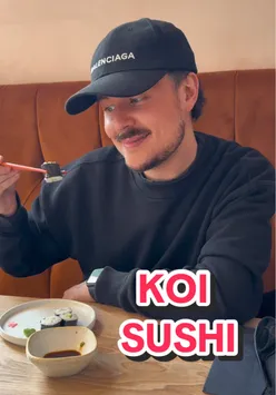 patrons enjoying sushi at Koi on Crow Road, a vibrant spot for fresh Japanese cuisine in Glasgow.