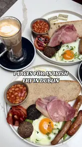 Full Irish fry-up with bacon, sausages, fried egg, and beans at The Art of Coffee, Dublin's trendy breakfast spot.