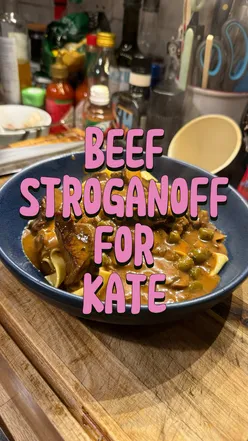 Delicious beef Stroganoff with cornichons, served in a cozy kitchen, inspired by @Kate Mai Fitzgerald's recent request.