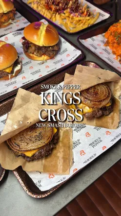 Excited diners enjoying smash burgers at the new Kings Cross opening in London.