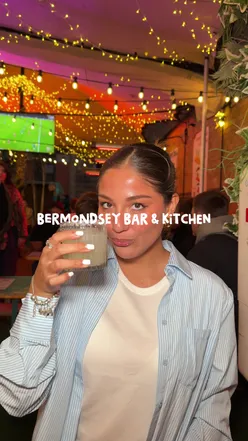 Enjoying cold beer, cocktails, and delicious food at Bermondsey Bar & Kitchen's vibrant beer garden.