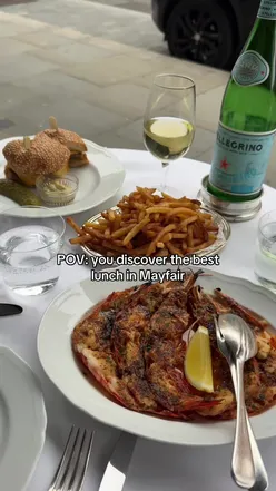 Dining at 74 Duke in Mayfair, enjoying wagyu burger and cognac butter prawns inspired by Parisian brasseries.