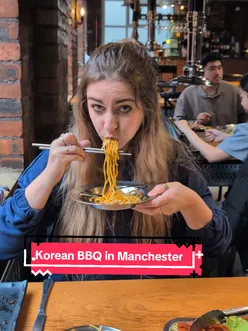 Interior of One Plus Chinese Restaurant in Manchester featuring a lively Korean BBQ atmosphere on the top floor.