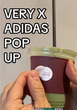 Guests enjoying coffee and floral décor at the adidas Coffee Haus pop-up in Covent Garden, London, celebrating sportswear.