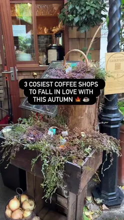 Cozy autumn-themed coffee shop scene in London, featuring warm drinks and inviting decor.