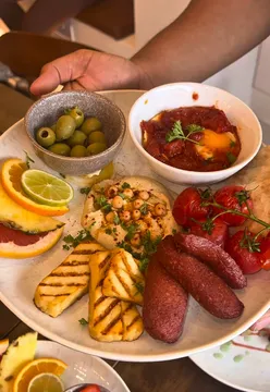 Delicious brunch spread at Atlas Bistro in Sutton featuring four thoughtfully crafted breakfast plates.
