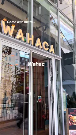 Delicious torta with Dusty Knuckle bread at Wahaca, showcasing vibrant flavors in a trendy London eatery.