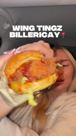Diners enjoying Wing Tingz chicken tenders at Railway Car Park in Billericay, Essex.