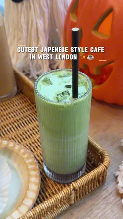 Cozy Japanese-style café Mitsuba in West London, featuring salmon, chicken dishes, and delightful red velvet and strawberry cakes.