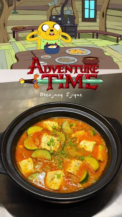 Delicious Doenjang Jjigae from Adventure Time, featuring tofu, pork, veggies, and flavorful Korean soybean paste.