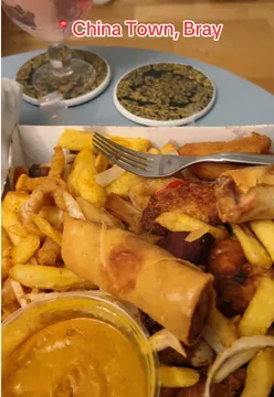 Delicious Saturday night Chinese takeaway with vibrant dishes enjoyed in a cozy setting.