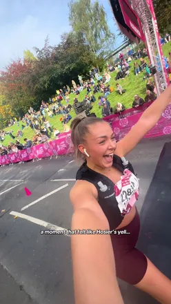 Runner celebrating after completing the Yorkshire 10-mile race, showcasing excitement and achievement.