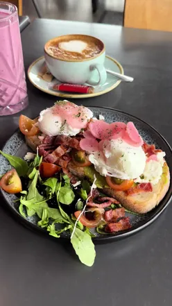 Person reflecting with a coffee on a Monday morning, embracing the concept of a reset for the week ahead.