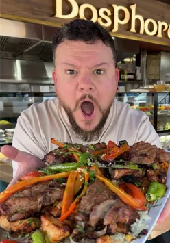 Delicious Turkish dishes at Bosphorus in Coventry, featuring a family platter of shawarma, kofta, and shish kebabs.