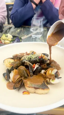 Delicious bouillabaisse with seafood by the sea at Olivula restaurant in Villefranche-sur-Mer, French Riviera.