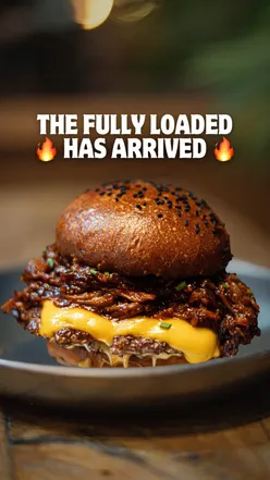 Ultimate BBQ Pulled Pork Burger with double patties and cheese at Founders in Swansea, a must-try for food lovers!