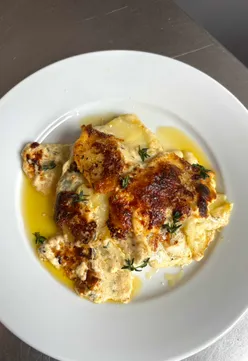 Truffle Butter Potato Dauphinois with Parmesan, a creamy layered dish perfect for festive dinners.