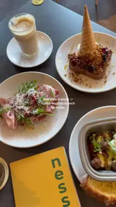 Brunch at Nesso Coffee in Leeds featuring Spanish latte, breakfast hash, antipasti crostone, and French toast.