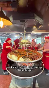 Visitors enjoying festive treats at the top-rated Christmas market in Cologne, Germany