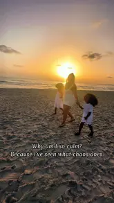 Calm mother reflecting on strength and peace for her kids amidst chaos, emphasizing protective love and resilience.