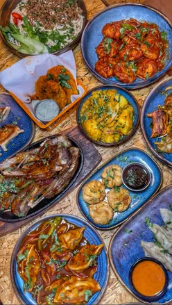 Diners enjoying a dedicated Momo menu featuring delicious Nepalese dishes at a vibrant restaurant.