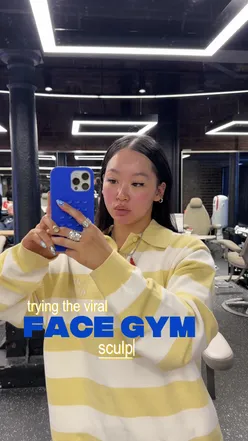 Enjoying sculpting facial treatment at Face Gym in Coal Drops Yard, with added LED therapy for tension relief.