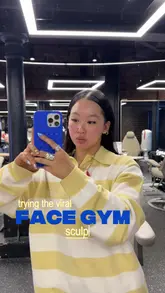 Enjoying sculpting facial treatment at Face Gym in Coal Drops Yard, with added LED therapy for tension relief.