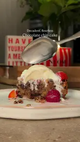 Decadent flourless chocolate chip cake, perfect for Christmas dessert; gluten-free and crowd-pleasing treat.