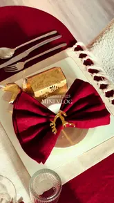Beautifully set Christmas dining table for 2025, adorned with festive decor and seasonal touches.