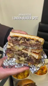 A fast-paced montage showcasing various burgers, hot dogs, loaded sides, and a milkshake from Brim Burgers. The video uses quick cuts to highlight the generous portions and 'loaded' nature of the food, ending with a brief shot of the venue interior.